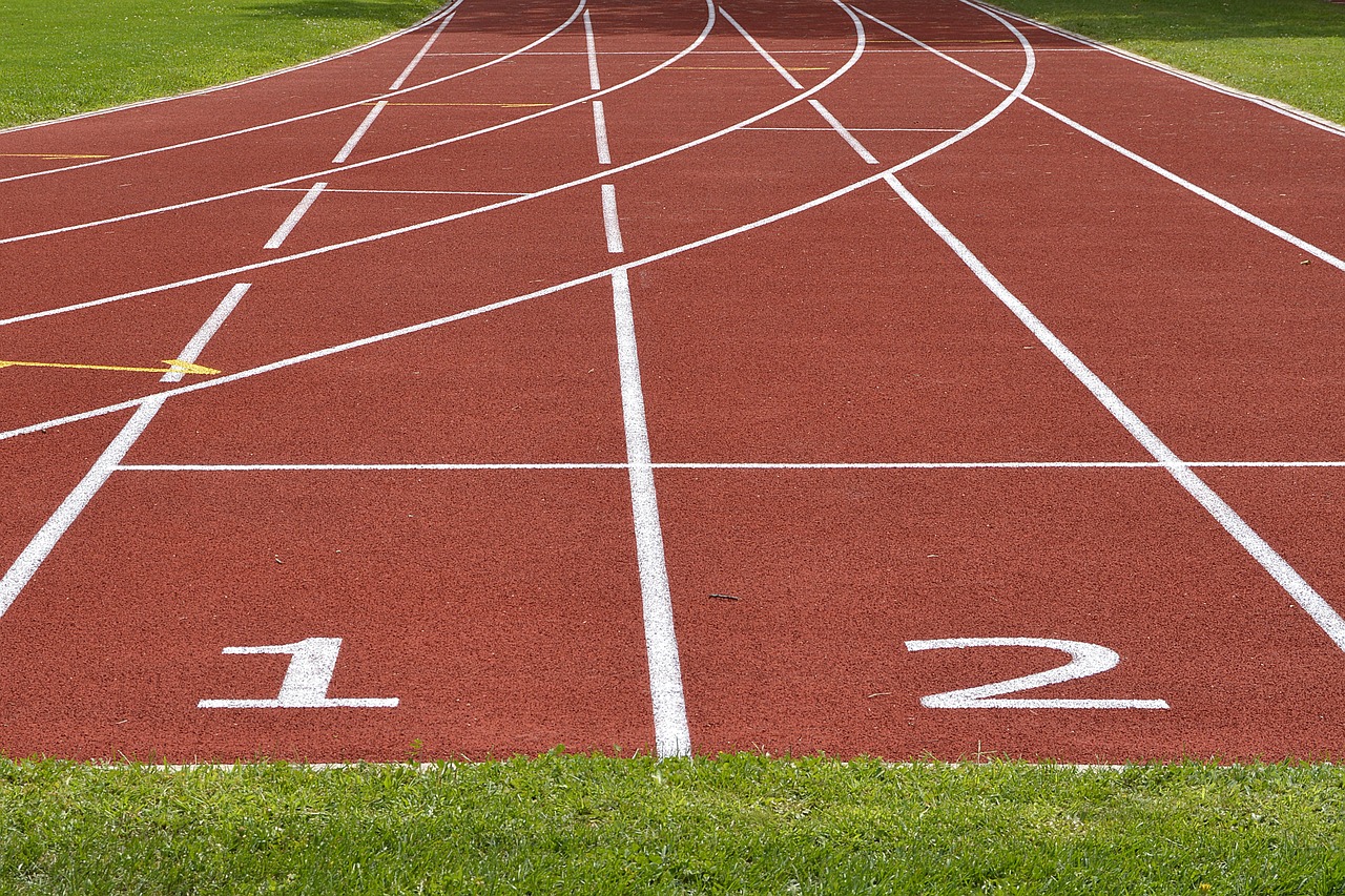a close up of a running track with numbers on it, a photo, by Whitney Sherman, shutterstock, folk art, 1128x191 resolution, game ready, victory lap, ; wide shot
