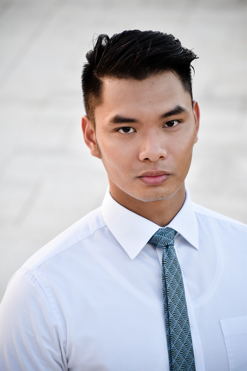 a close up of a person wearing a shirt and tie, a portrait, inspired by Ryan Yee, acting headshot, asian descent, outdoors business portrait, with serious face expression