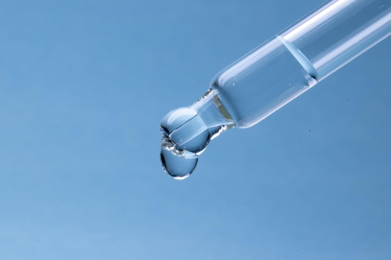 a drop of water sitting on top of a pipe, shutterstock, glass vials, relaxed. blue background, iv pole, high detail product photo