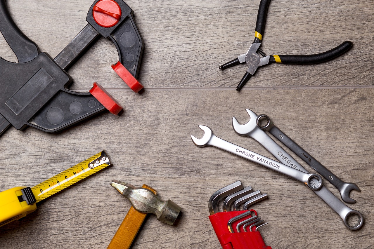 a group of tools sitting on top of a wooden floor, by Juan O'Gorman, modernism, wrench, high-quality wallpaper, inspect in inventory image, test