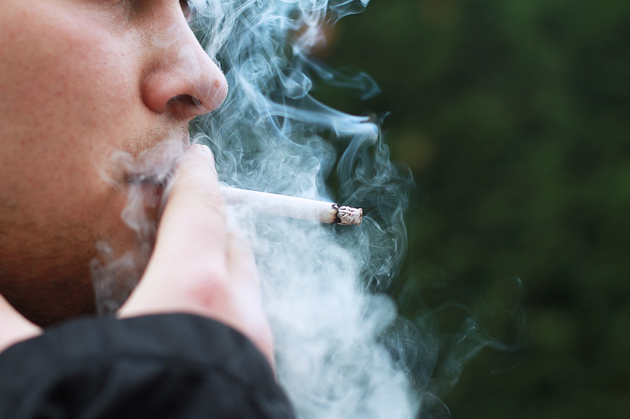 a close up of a person smoking a cigarette, a portrait, by Jakob Gauermann, shutterstock, smoking outside, stock photo