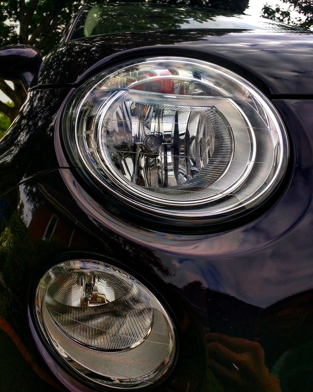 a close up of the headlights of a car, a picture, by Jan Rustem, pexels, photorealism, mini cooper s, shot with iphone 1 0, oval face, !!natural beauty!!