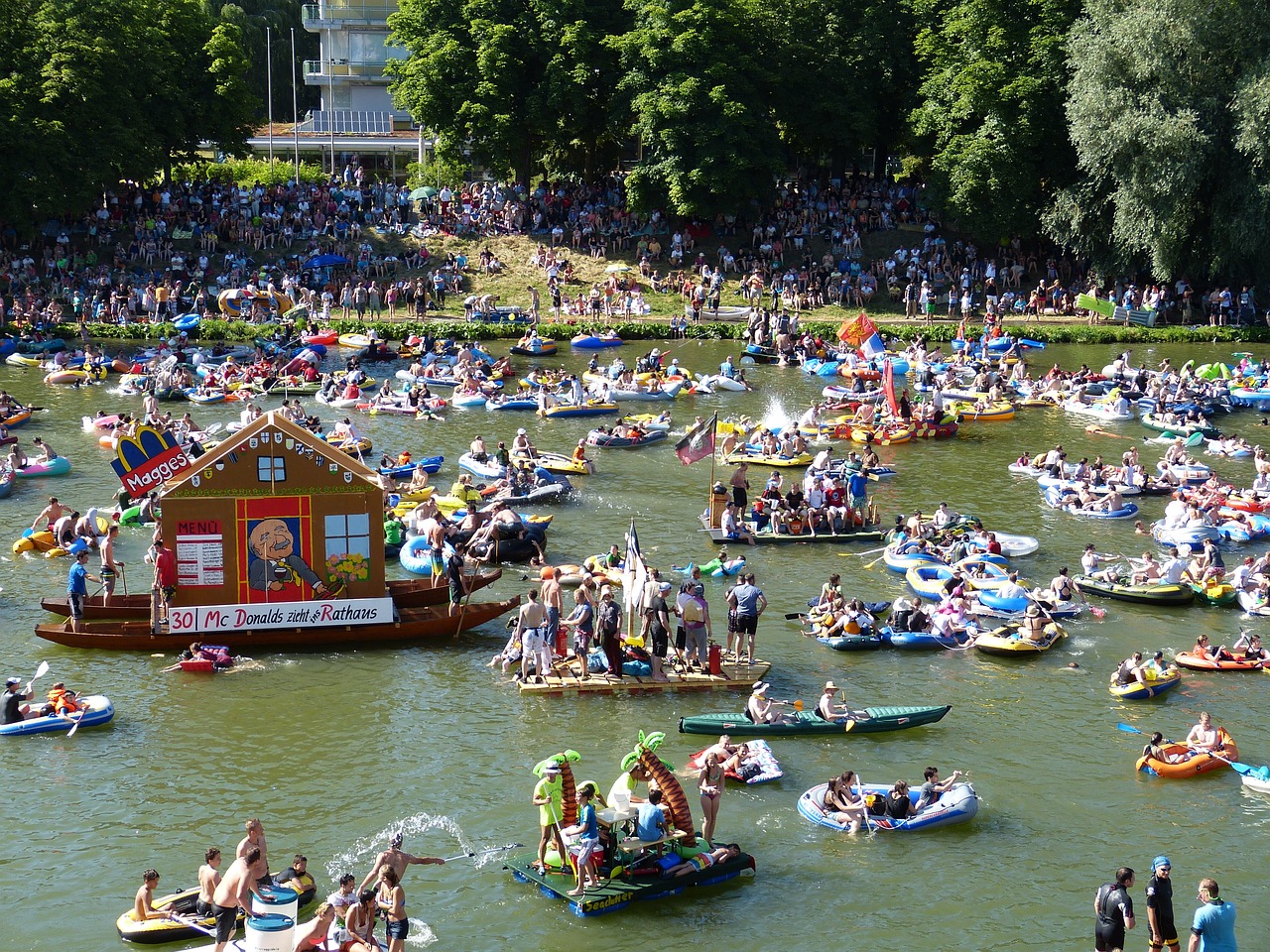 a large group of people floating on top of a river, a photo, figuration libre, parade floats, gigapixel photo, photo photo