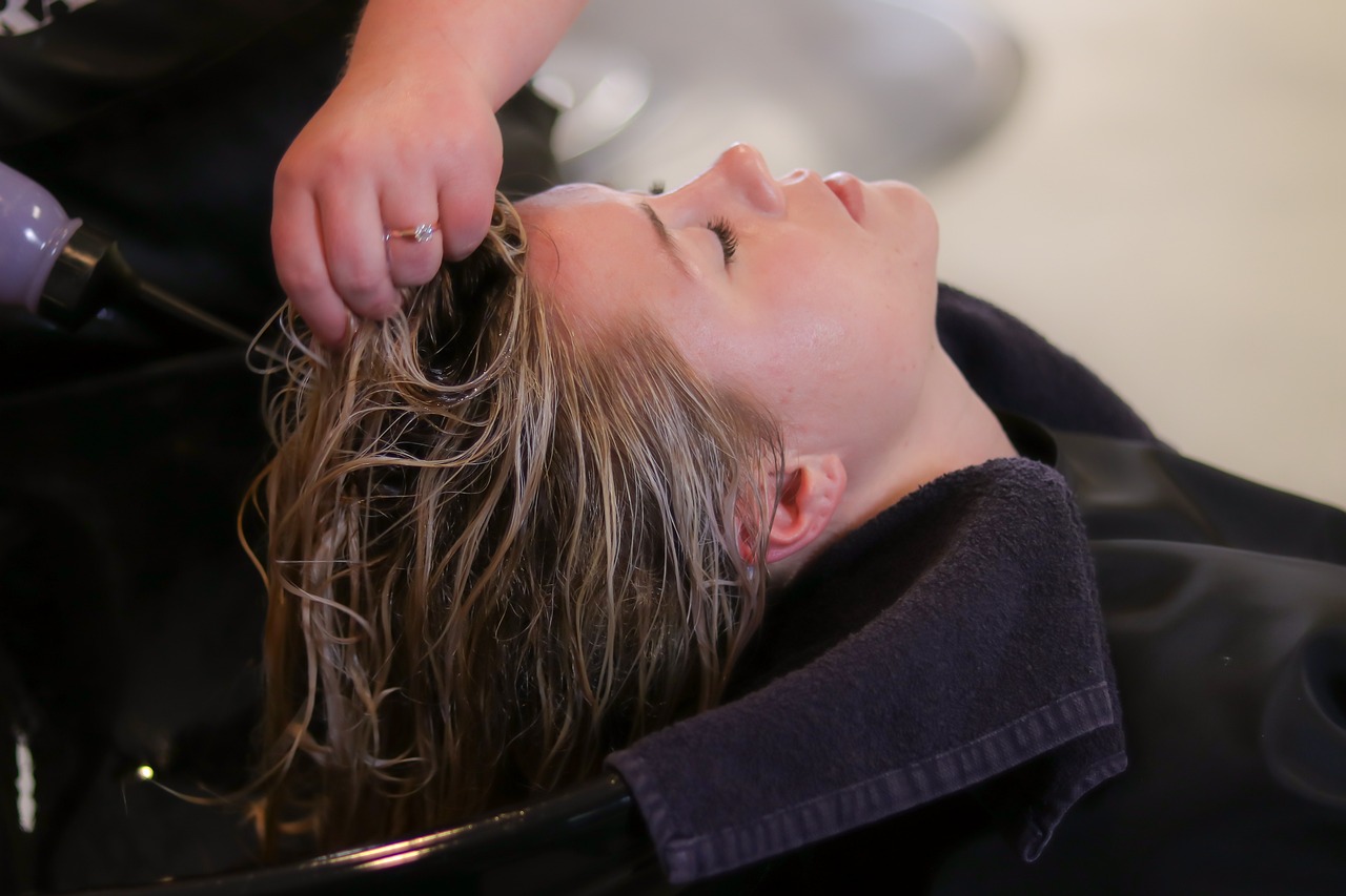 a woman getting her hair brushed by a hair stylist, by Adam Manyoki, soaking wet hair, human head with blonde hair, high def, hands on face