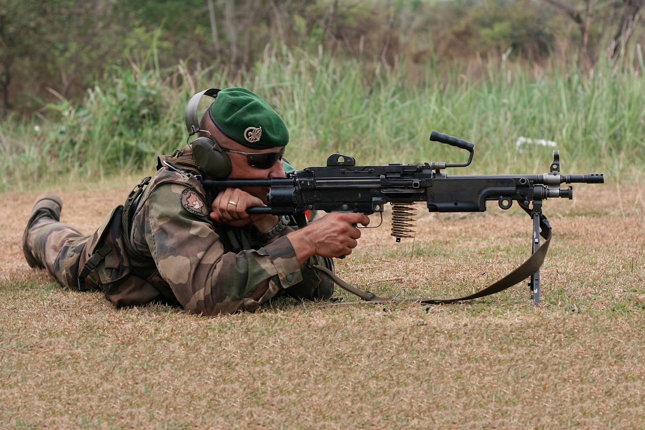 a man laying on the ground with a machine gun, flickr, figuration libre, french special ops, firing laser, pararel, profile picture