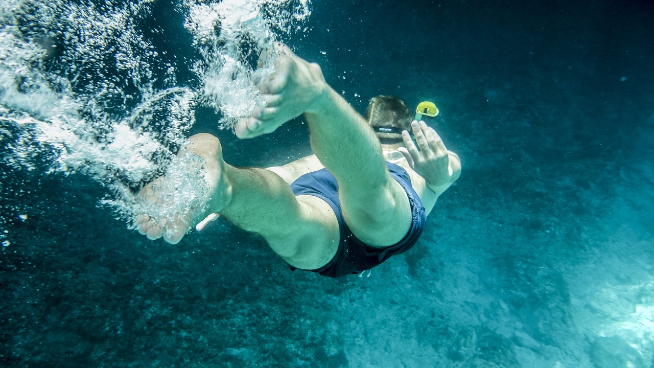 a person that is swimming in the water, by Matt Cavotta, extreme foreshortening, adventure, mikko, full res