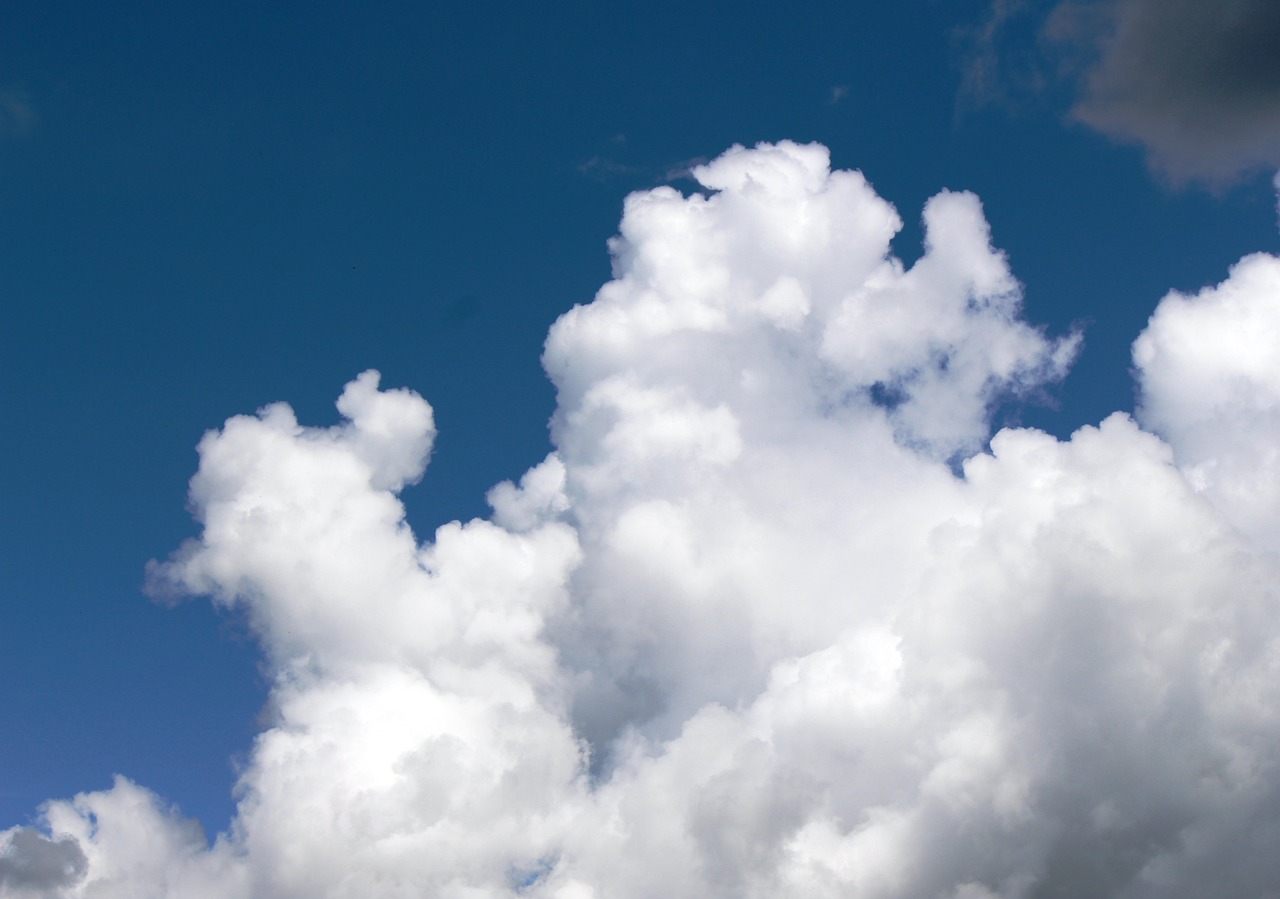 there is a plane that is flying in the sky, by Linda Sutton, flickr, cumulus cloud tattoos, white, stock photo, elevation