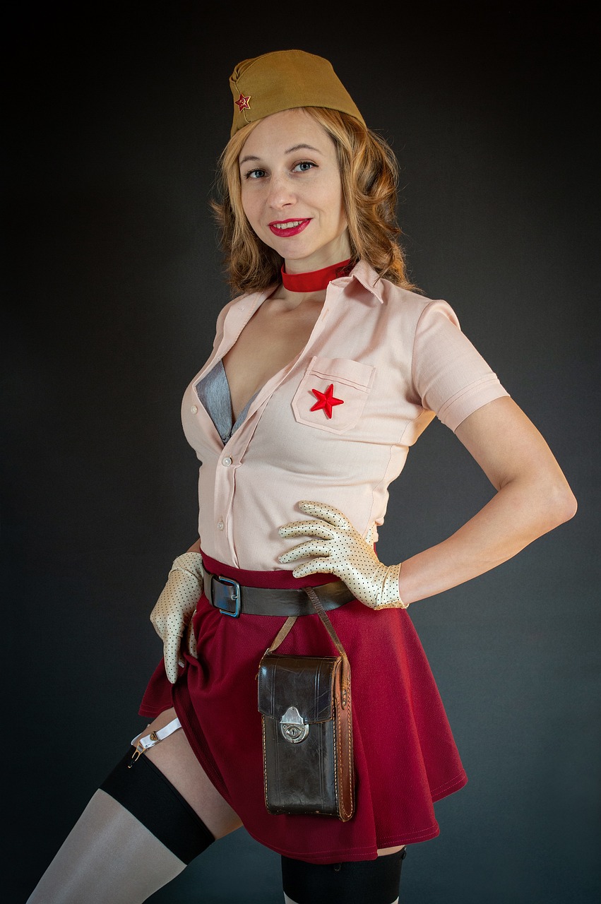 a woman dressed as a nurse poses for a picture, a portrait, inspired by Gil Elvgren, flickr, female protagonist 👀 :8, holster, with a red skirt, bronze!! (eos 5ds r