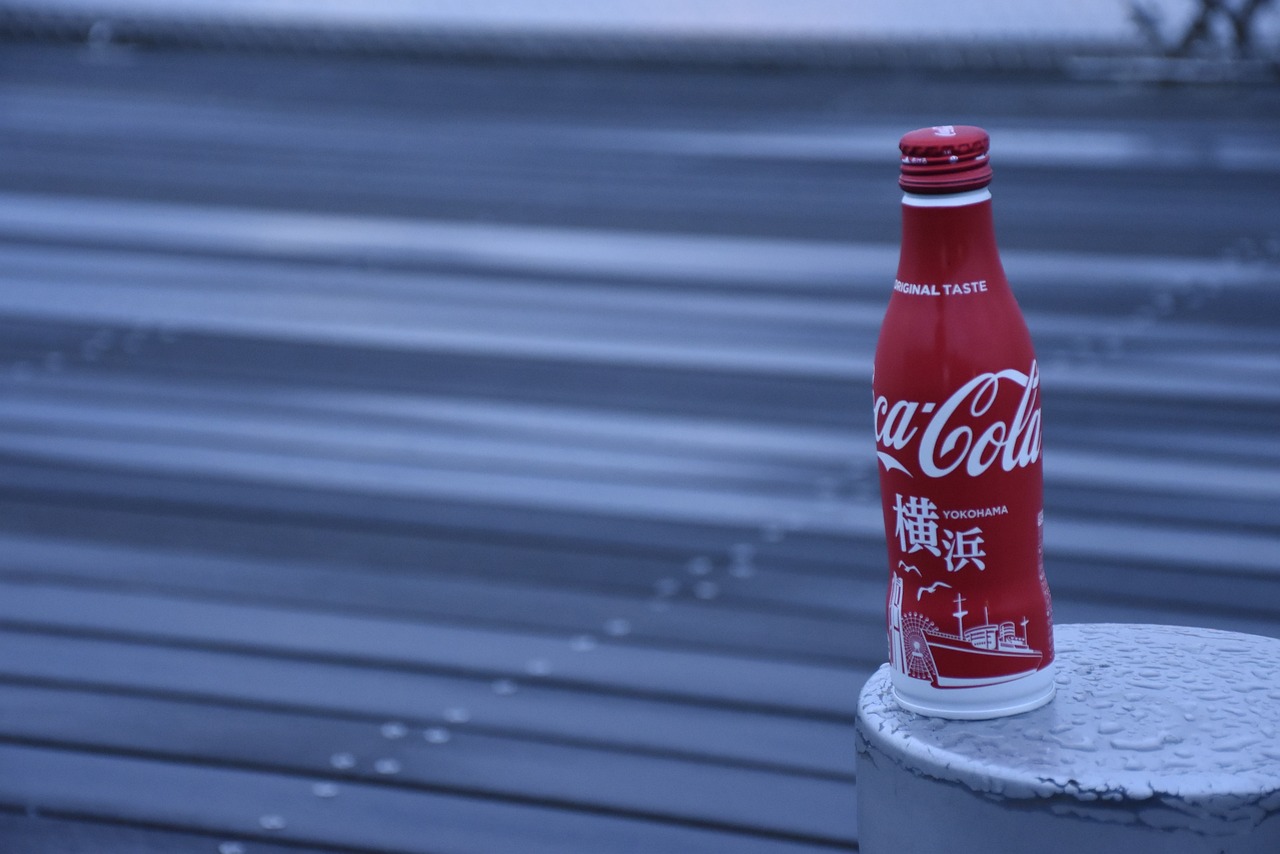 a coke bottle sitting on top of a cement post, a photorealistic painting, inspired by Cao Buxing, unsplash, on rooftop tokyo night, low quality footage, hyper-realistic cg, red monochrome