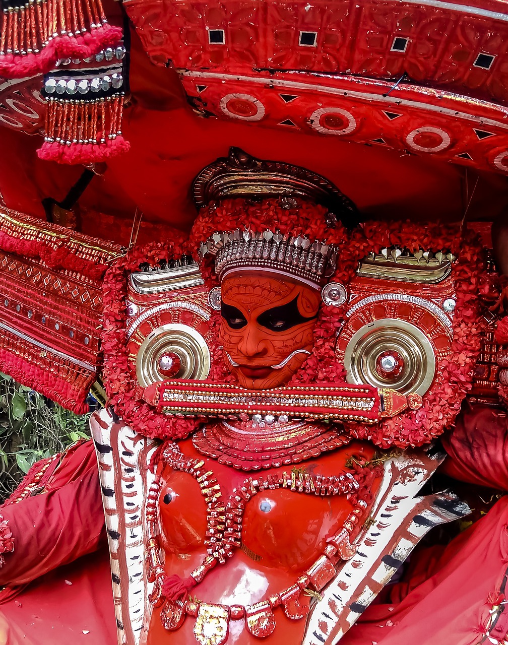 a close up of a person wearing a costume, a detailed painting, by Robert Brackman, pexels contest winner, kerala village, red demon armor, full - view, very very well detailed image