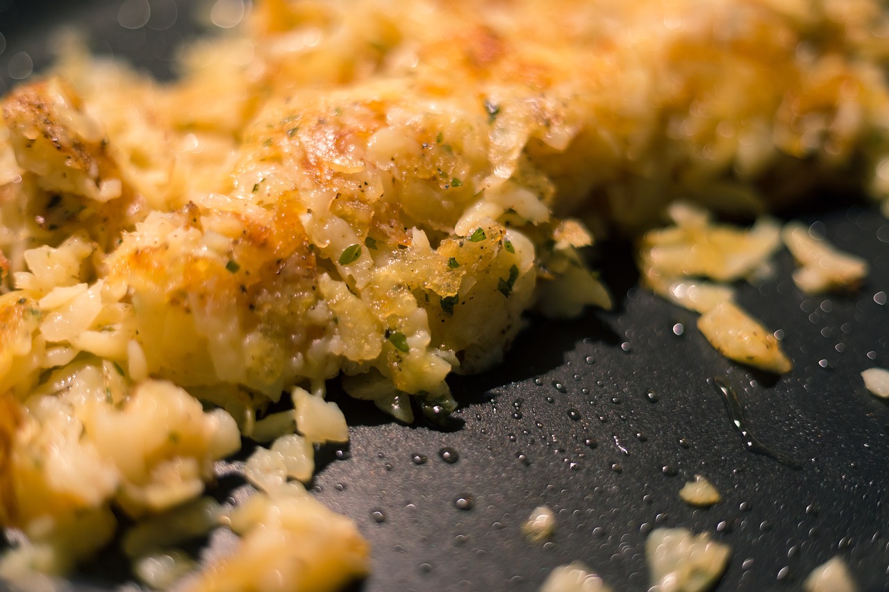 a close up of some food on a pan, a macro photograph, by Matt Cavotta, flickr, renaissance, potato skin, tatsumaki, very crispy, onion
