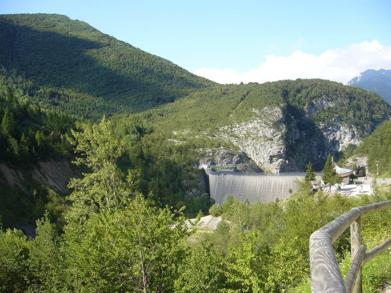 a large body of water next to a forest, flickr, les nabis, wall of water either side, mills, abbondio stazio, granite