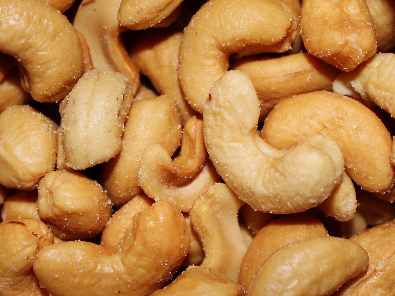 a pile of cashews sitting on top of each other, high quality product image”