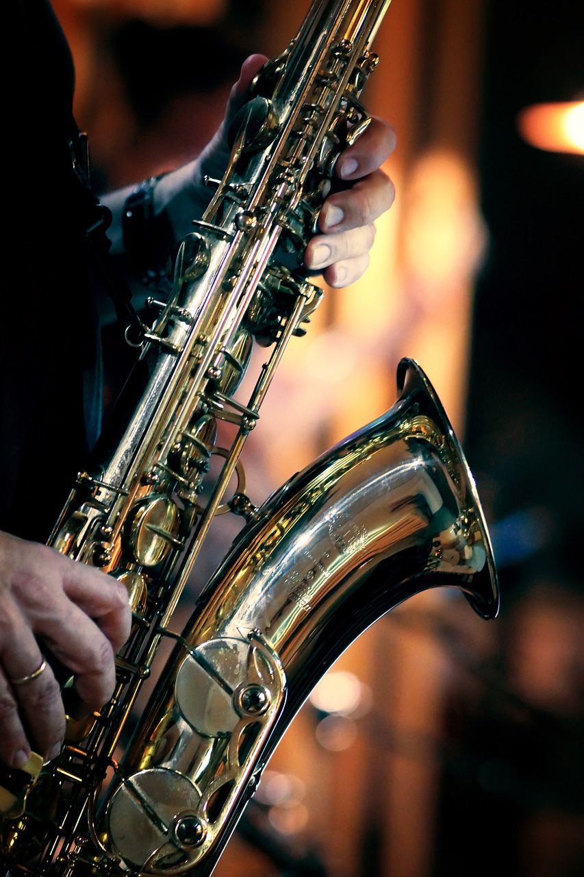 a close up of a person playing a saxophone, a tilt shift photo, by Bernard Meninsky, shutterstock, shiny brass, detailed an empty jazz cafe, music festival, stock photo