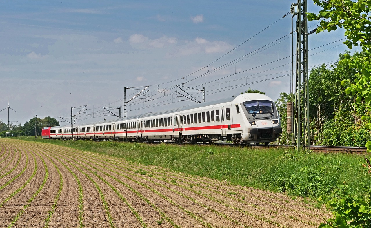 a large long train on a steel track, by Hans Schwarz, flickr, high speed trains, in summer, with a long white, osr