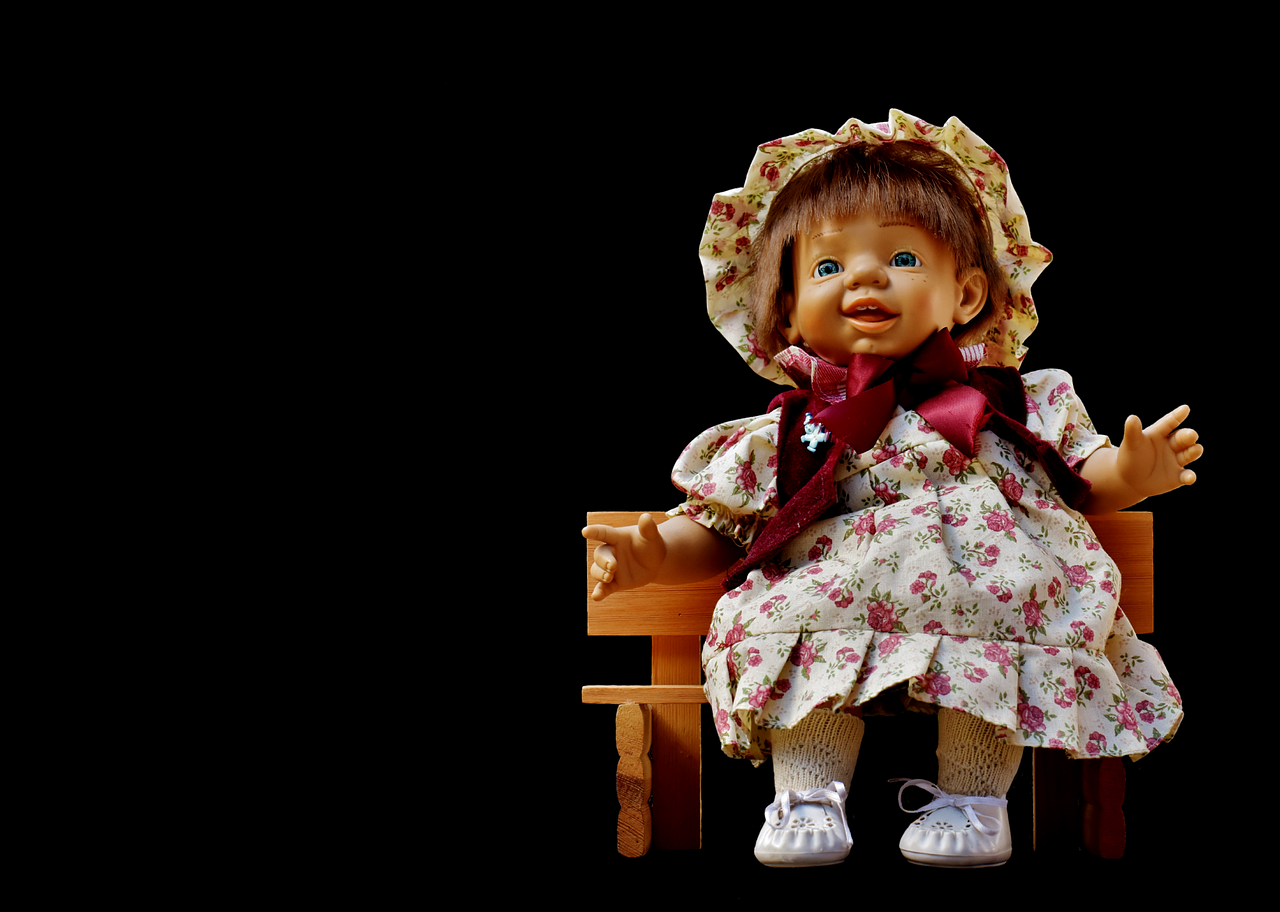 a doll sitting on top of a wooden bench, by Bernardino Mei, pixabay contest winner, renaissance, she is smiling and excited, on black background, toddler, frilly outfit
