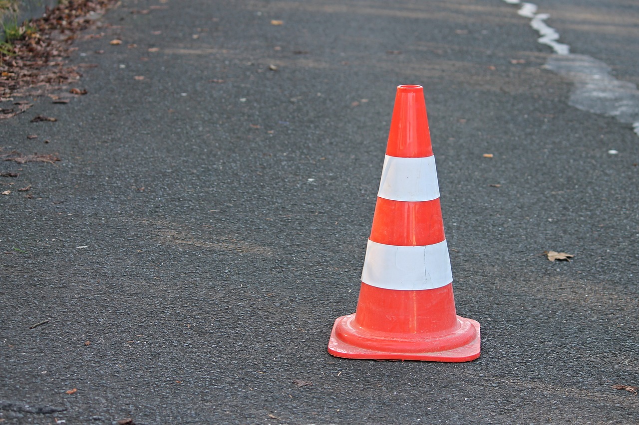 a traffic cone sitting on the side of a road, a photo, plasticien, full length photo, istockphoto, handcrafted, stock photo