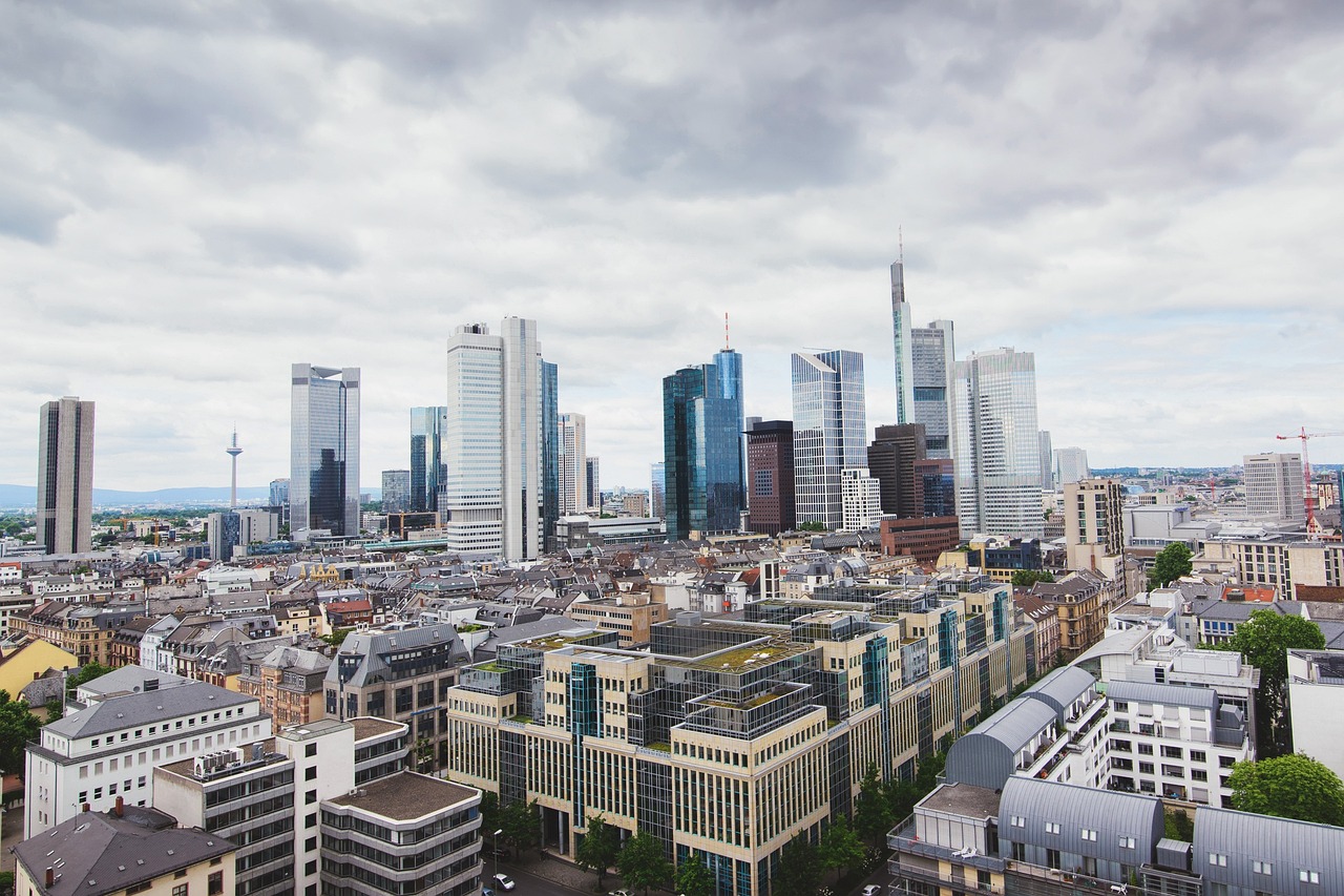 a view of a city from the top of a building, by Tom Wänerstrand, pexels, modernism, germany. wide shot, france, skyscrapers on the background, wikimedia commons