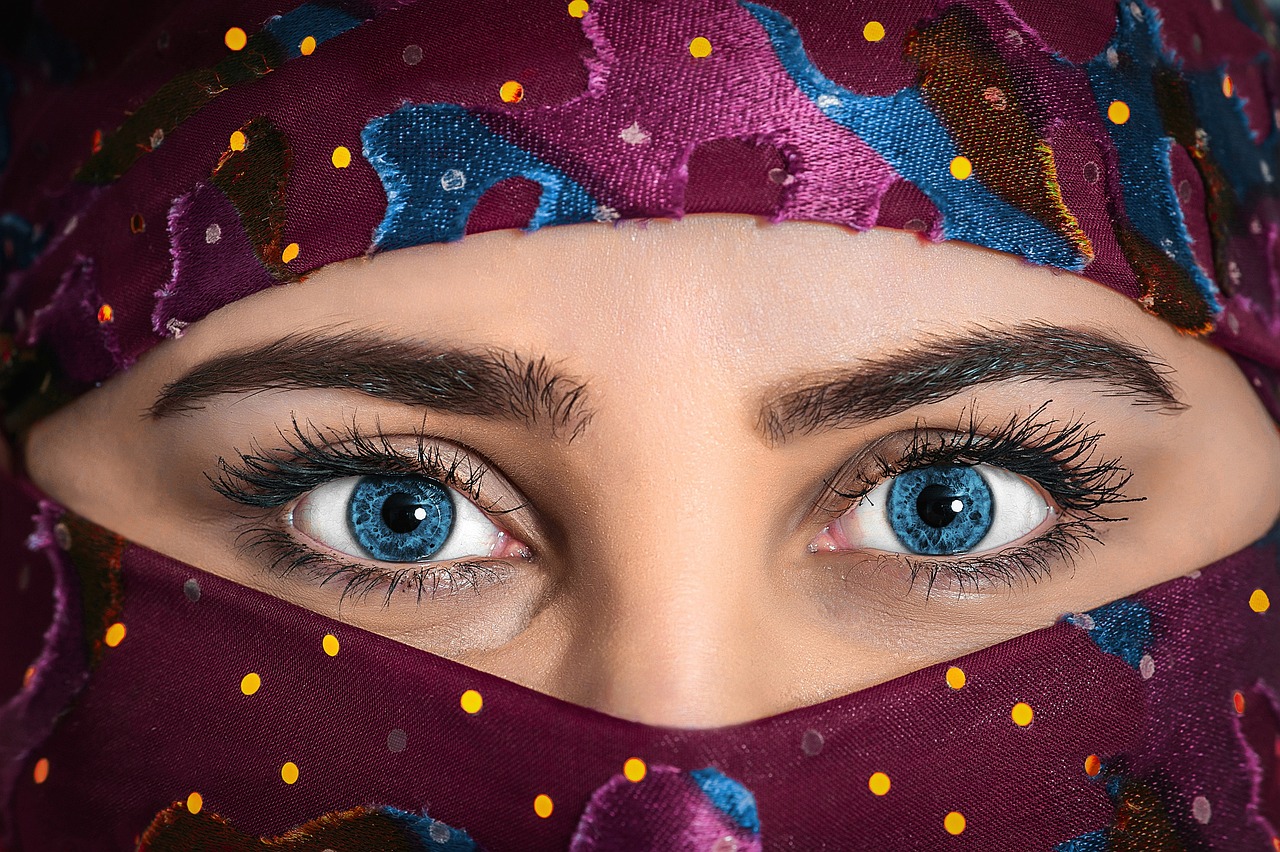 a close up of a woman's face with blue eyes, by Abdullah Gërguri, trending on pixabay, arabian nights inspired, eyes). full body, profile picture 1024px, young middle eastern woman