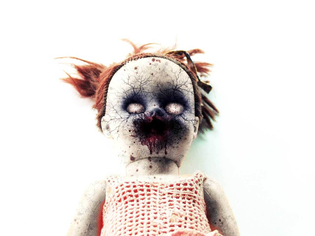 a close up of a doll with blood on it's face, by Anita Kunz, on a pale background, grunge, toy photo, terrified