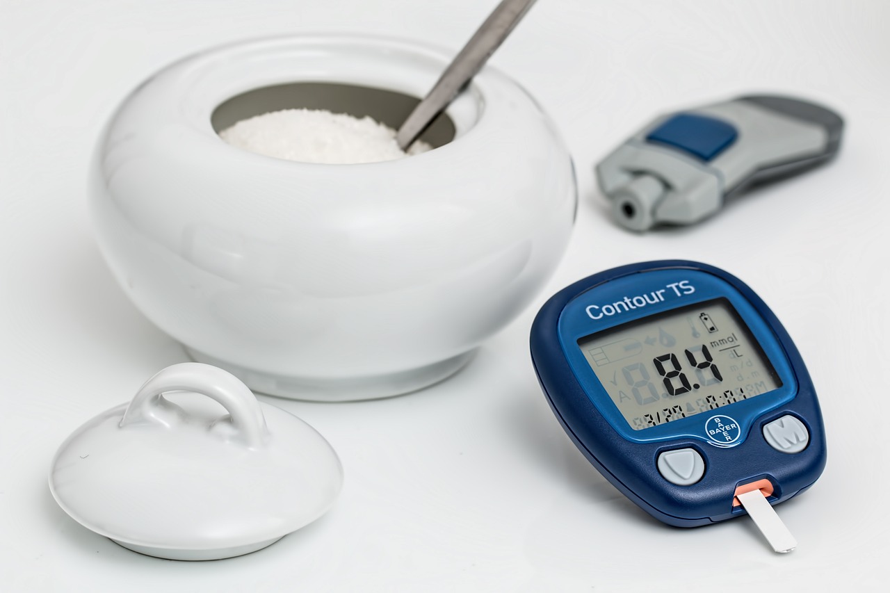 an electronic device sitting next to a bowl of sugar, medical image, gauges, indoor, information