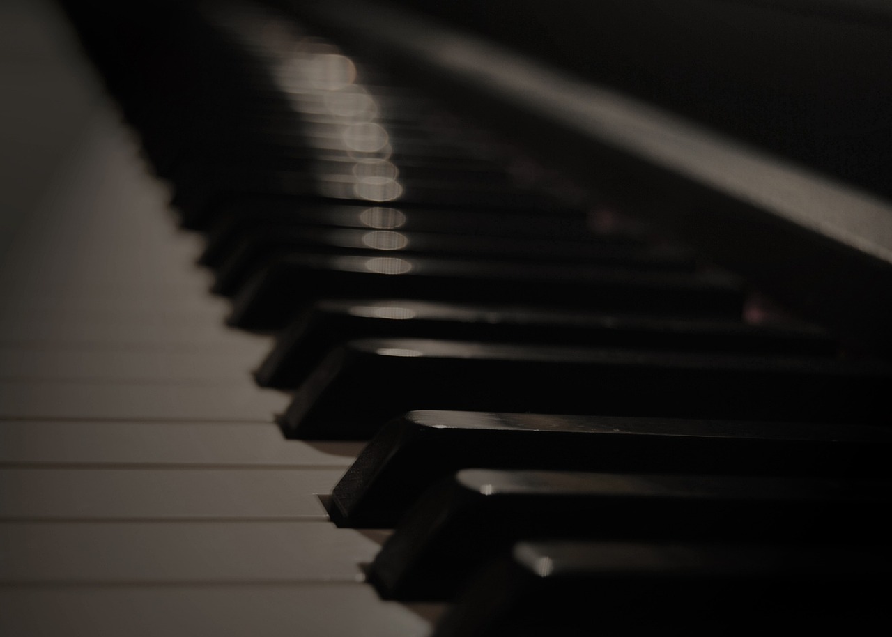 a close up of the keys of a piano, a picture, by Eugeniusz Zak, moody dim faint lighting, vertical wallpaper, denis velleneuve, repetitiveness