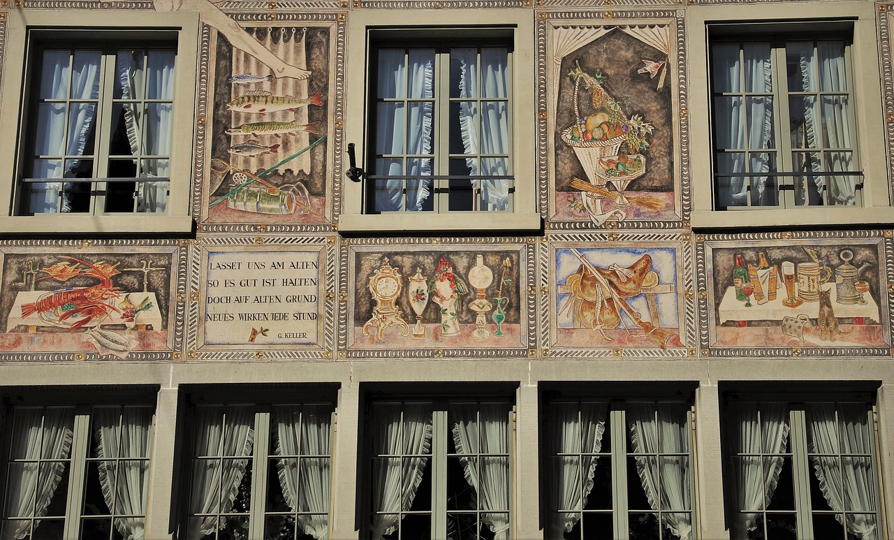 a building with a mural on the side of it, a mosaic, inspired by Limbourg brothers, flickr, panels, photo of zurich, alchemical still made from clay, tiles curtains