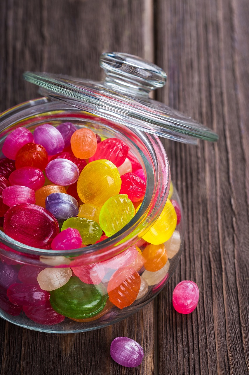 a glass jar filled with candy sitting on top of a wooden table, by david rubín, pexels, process art, gumdrops, full of colour 8-w 1024, professional fruit photography, 😃😀😄☺🙃😉😗