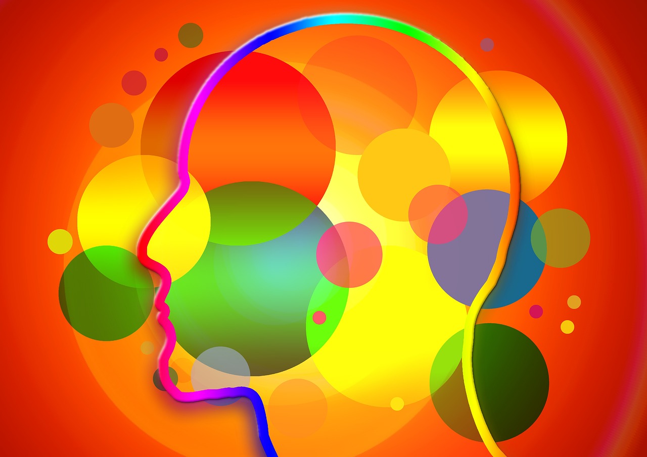 a close up of a person's head wearing a pair of headphones, a digital rendering, inspired by Milton Glaser, pixabay, digital art, !!! very coherent!!! vector art, colorful background, soap bubble mind, yellow and orange color scheme