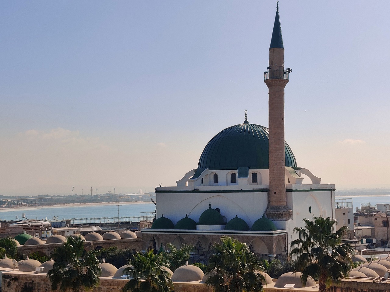 a large white building with a green dome, a picture, hurufiyya, the sea seen behind the city, orientalisme, dome, tanned ameera al taweel