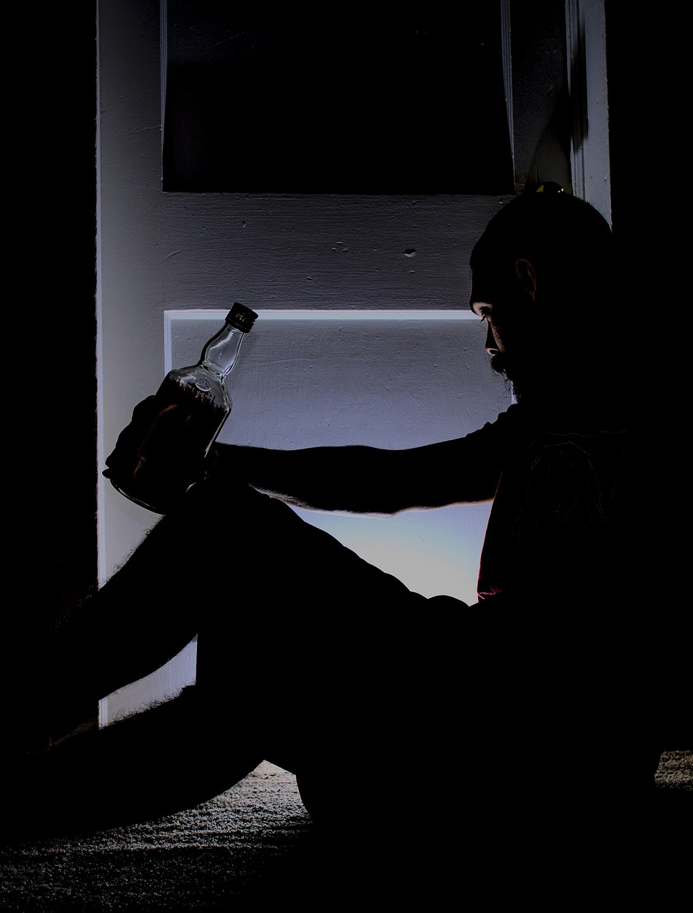 a man sitting in front of a window holding a bottle, by Tom Carapic, pixabay, late night melancholic photo, full pose, silhouette :7, drunk woman