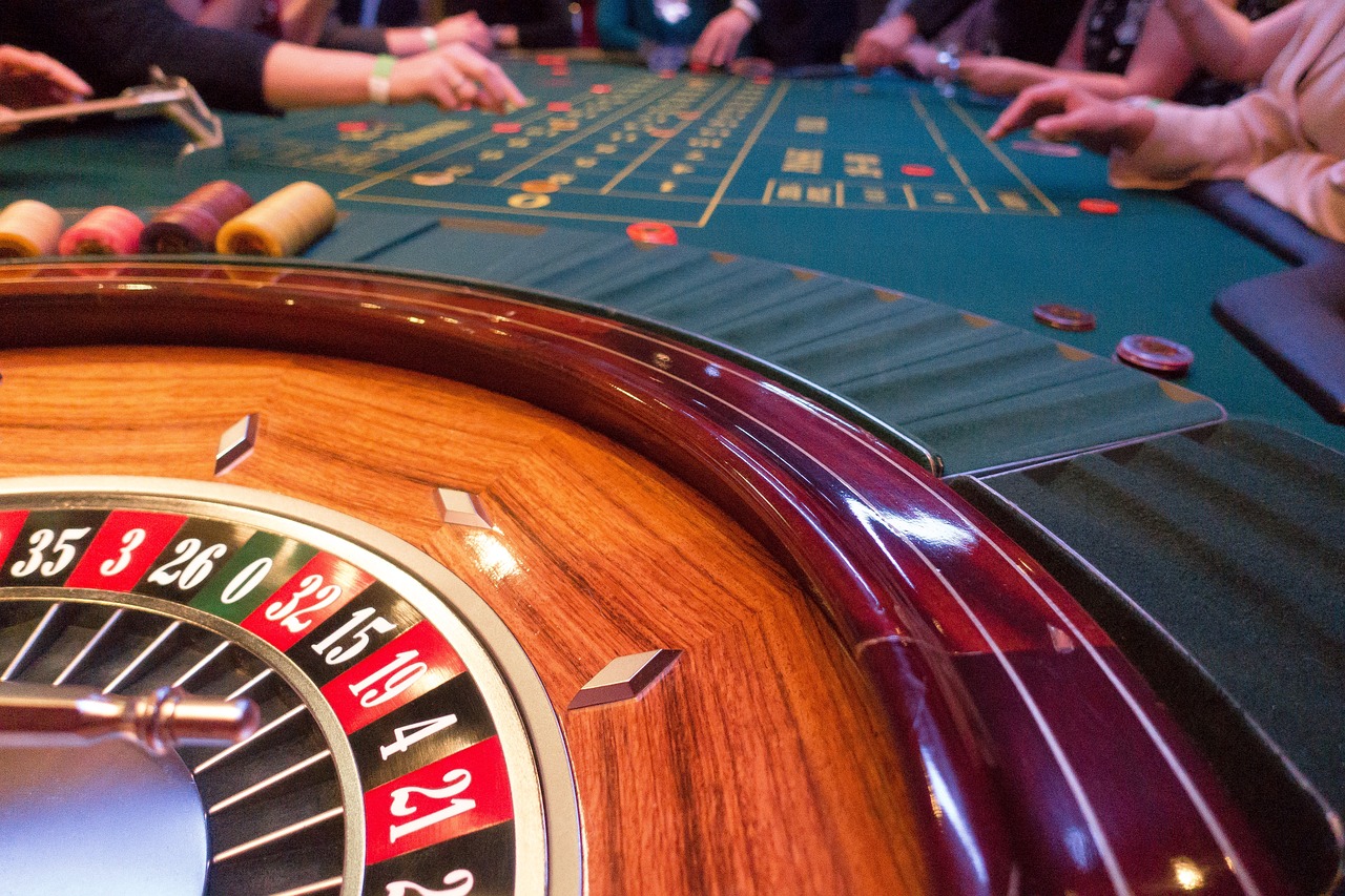 a close up of a casino roulette wheel on a table, renaissance, a busy arcade, iphone photo, 🎨🖌️, wooden tables