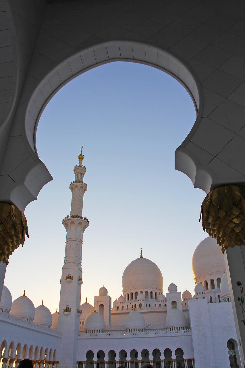 a group of people standing in front of a white building, a picture, inspired by Sheikh Hamdullah, shutterstock, dau-al-set, with great domes and arches, view from inside, sun at dawn, crisp details