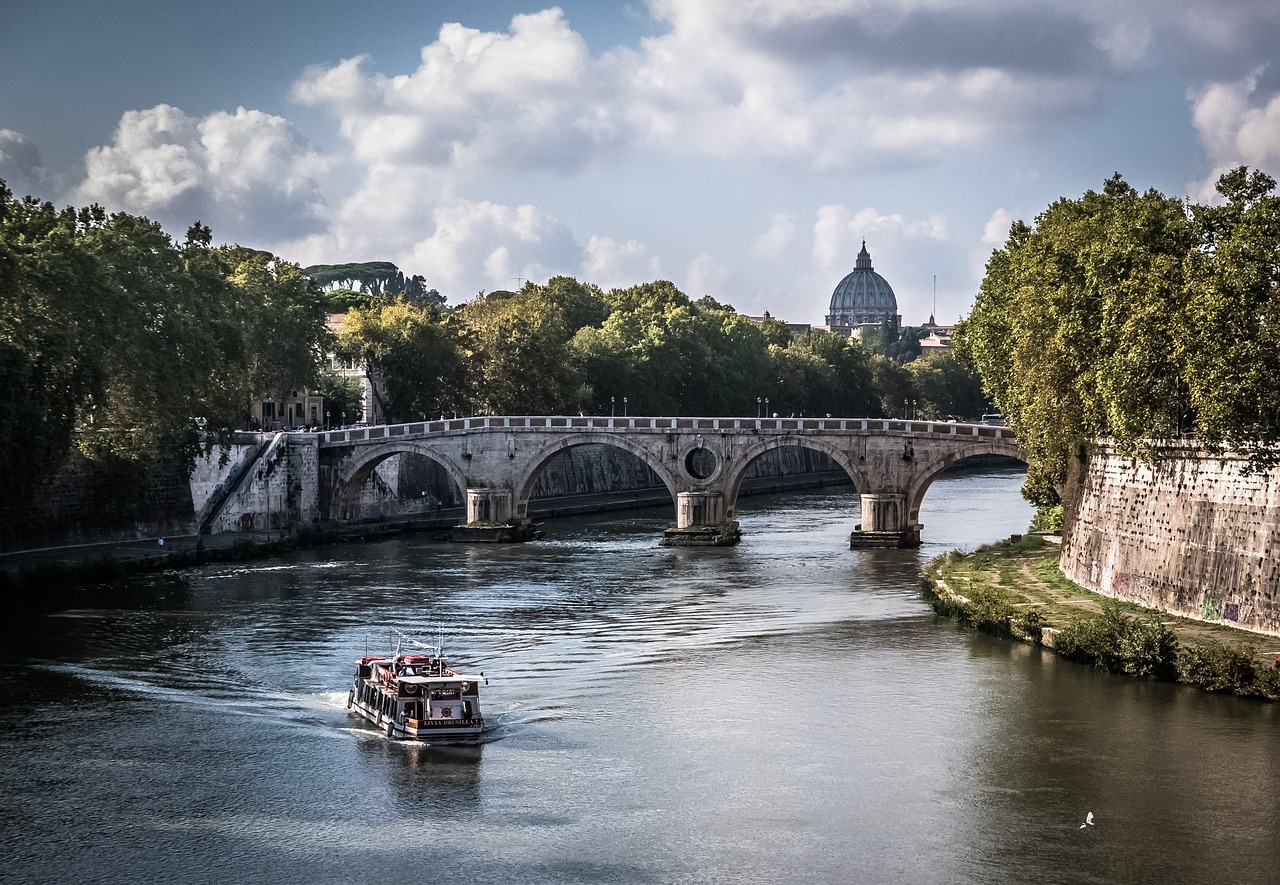 a boat traveling down a river next to a bridge, by Patrick Pietropoli, pexels contest winner, renaissance, roma, 2 5 6 x 2 5 6, summer afternoon, wikimedia