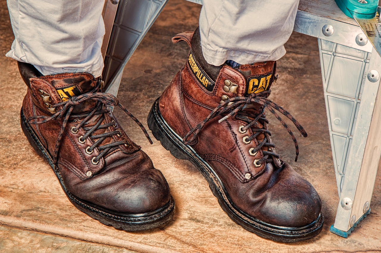 a close up of a pair of brown boots, a portrait, by Randy Gallegos, trending on pixabay, construction, half cat, worksafe. 2000s, 🕹️ 😎 🔫 🤖 🚬