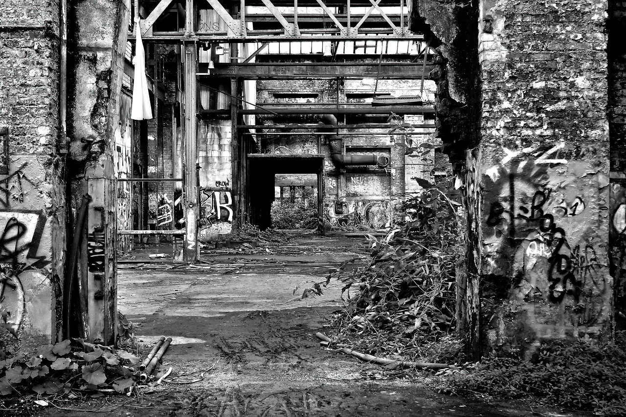 a black and white photo of an abandoned building, process art, pipe jungle, the gate to hell, industrial colours, iron and asphalt
