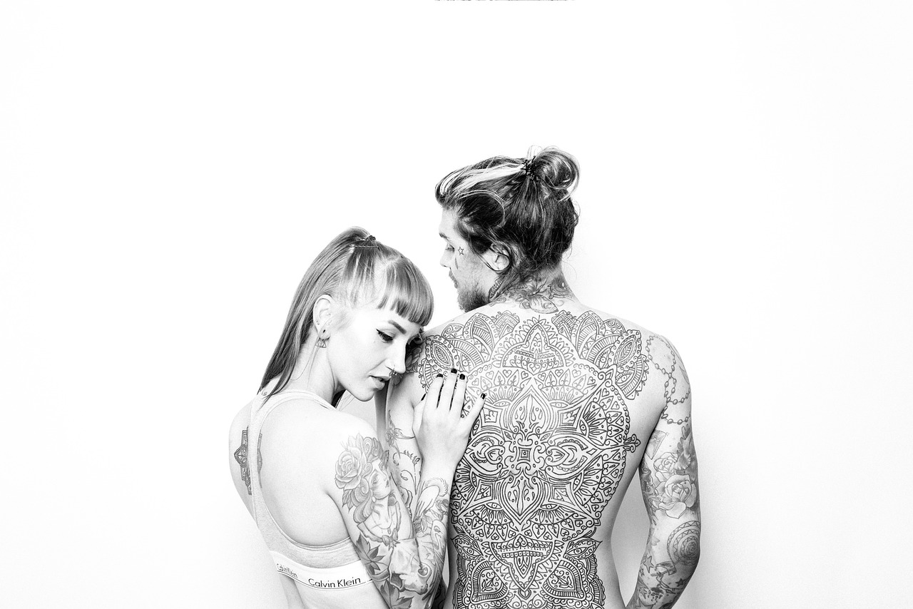 a man and a woman standing next to each other, a tattoo, tumblr, high - key photography, alex grey and tim hildebrandt, they are in love, in kaethe butcher