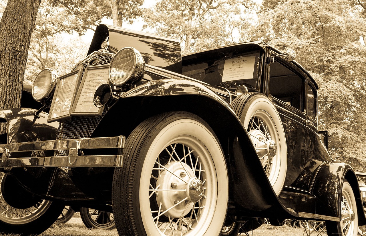 a black and white photo of a vintage car, by Dave Melvin, flickr, leyendecker style, sepia sunshine, smart looking, fine workmanship