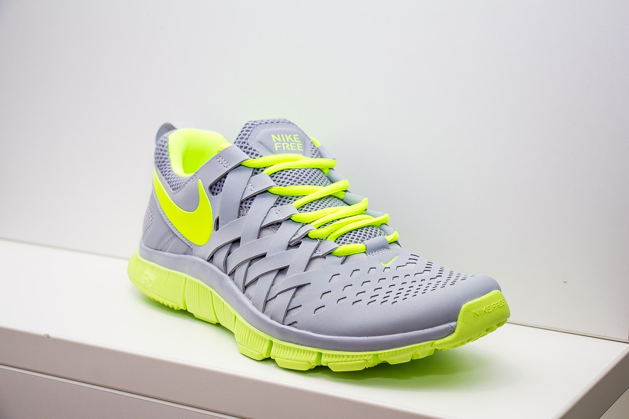 a close up of a pair of shoes on a shelf, by Maksimilijan Vanka, shutterstock, nike alpha huarache 7 elite, with fluo colored details, grey metal body, highly detailed product photo