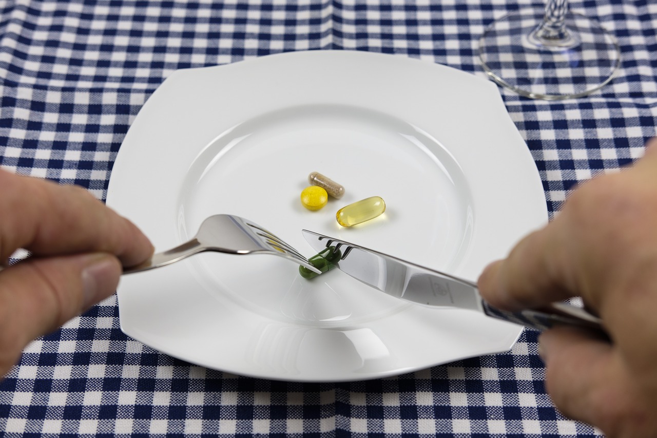 a person cutting a piece of food with a knife and fork, by Mathias Kollros, antipodeans, pills, served on a plate, very accurate photo, high res photo