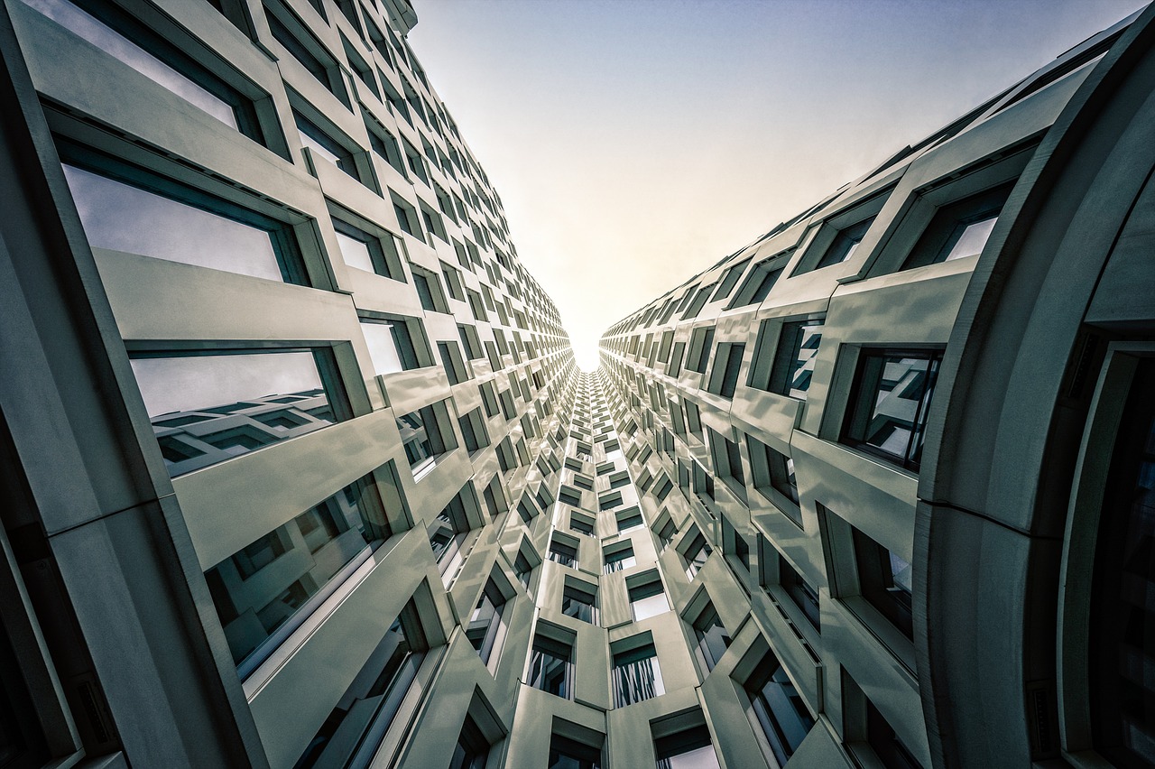 a very tall building with lots of windows, by Thomas Häfner, shutterstock, epic scale fisheye view, twisted rays, blocking the sun, abstract facades of buildings