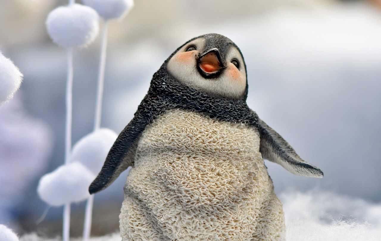 a close up of a toy penguin in the snow, a picture, by Arthur Pan, happening, cute detailed digital art, pure joy, oscar winning, bubbles ”