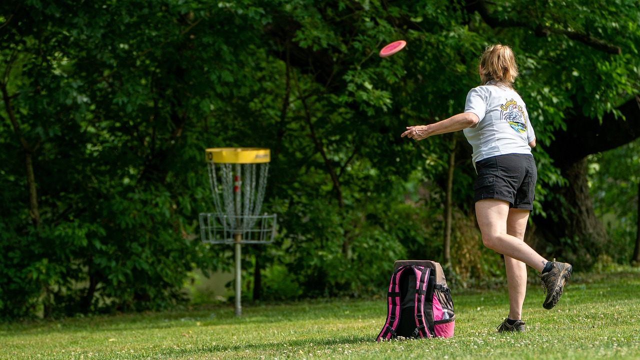 a woman jumping in the air to catch a frisbee, a portrait, by Dietmar Damerau, flickr, 8k 50mm iso 10, chalk, tournament, off - putting