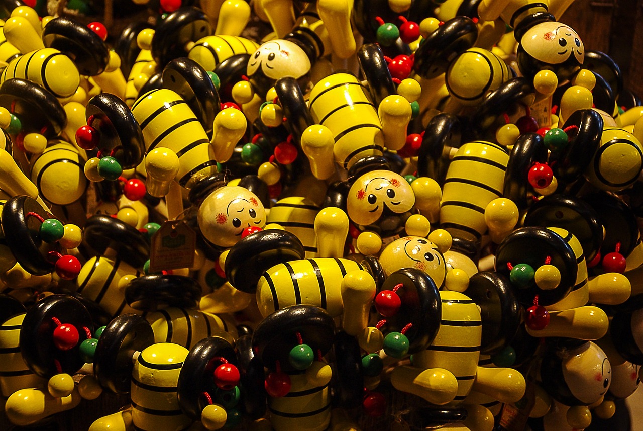 a bunch of toy figurines sitting on top of each other, a picture, by Jan Konůpek, flickr, toyism, big bee, wooden banks, twisty, floating pieces