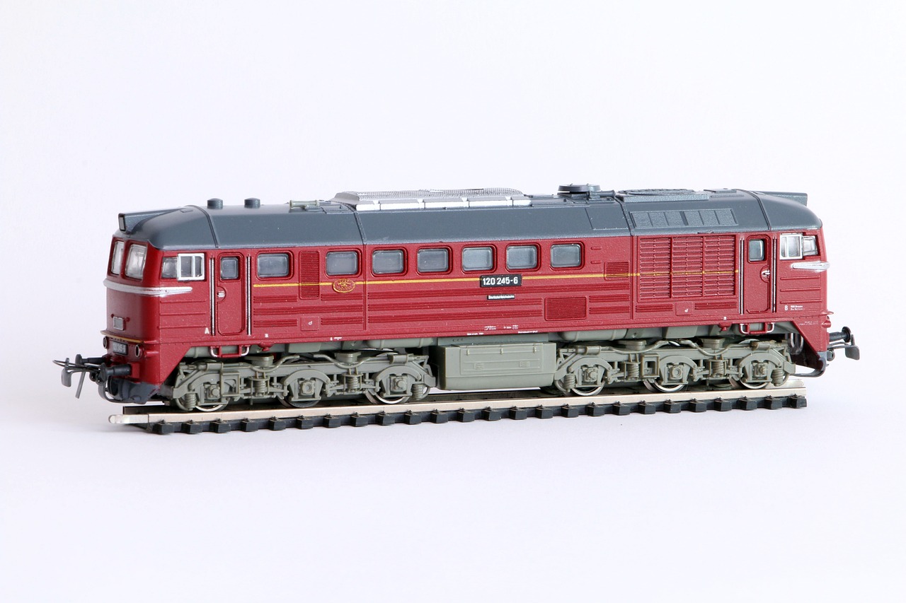 a close up of a toy train on a white surface, inspired by Hasegawa Tōhaku, tumblr, wine-red and grey trim, 1962 soviet, super model-s 100, highly detailed product photo