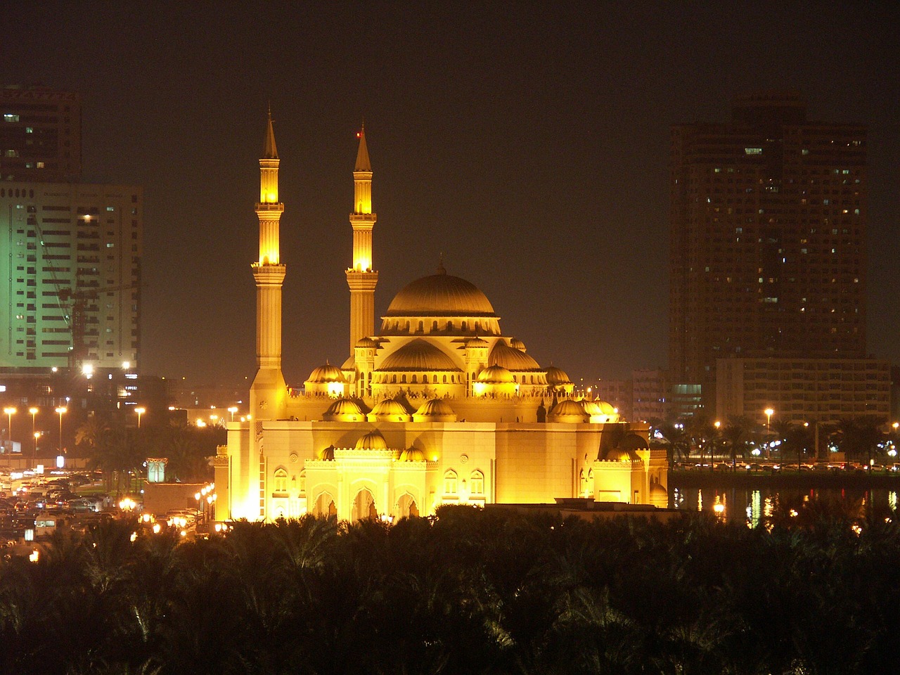 a large building in the middle of a city at night, a picture, by Sheikh Hamdullah, flickr, hurufiyya, cybermosque interior, golden glow, by :5 sexy: 7, african ameera al taweel