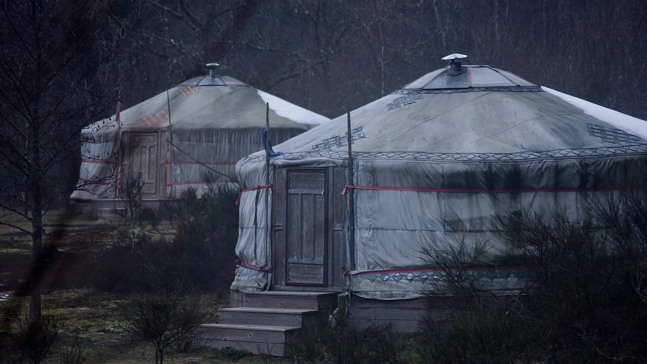 a couple of yurts sitting next to each other, a detailed matte painting, by Richard Carline, flickr, silent hill in real life, filmed in 70mm, rainny, january 20th