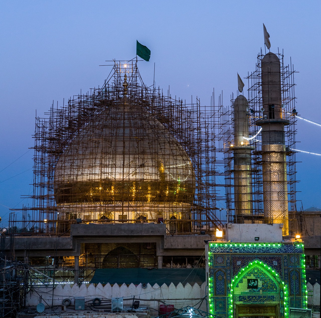 a large building with a lot of scaffolding around it, by Kamāl ud-Dīn Behzād, shutterstock, dau-al-set, shrine, predawn, green, reconstruction