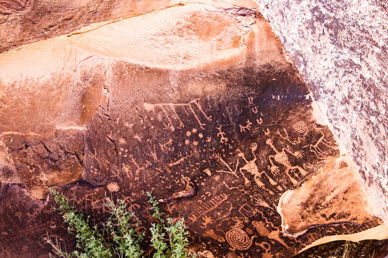 a close up of a rock with a painting on it, a cave painting, graffiti, usa-sep 20, highly detailed carvings, moab, runes in the air