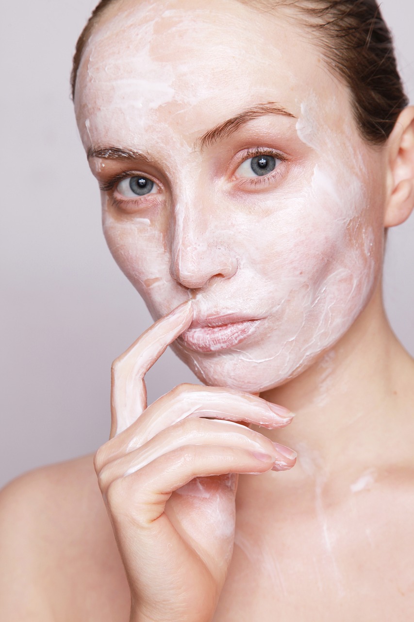 a close up of a person with a face mask on, by Lena Alexander, pexels, milk - bath effect, hand on her chin, chalk white skin, woman model